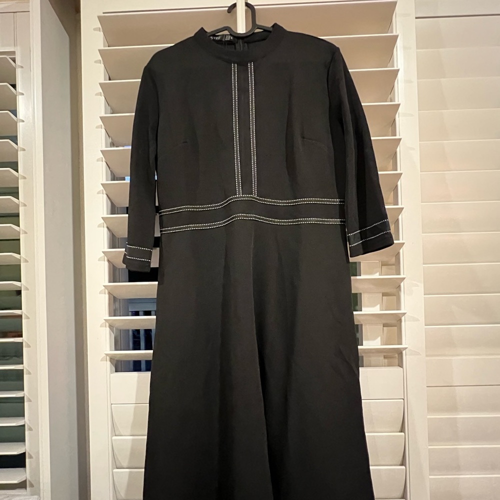 Elegant Black Dress with White Stitching